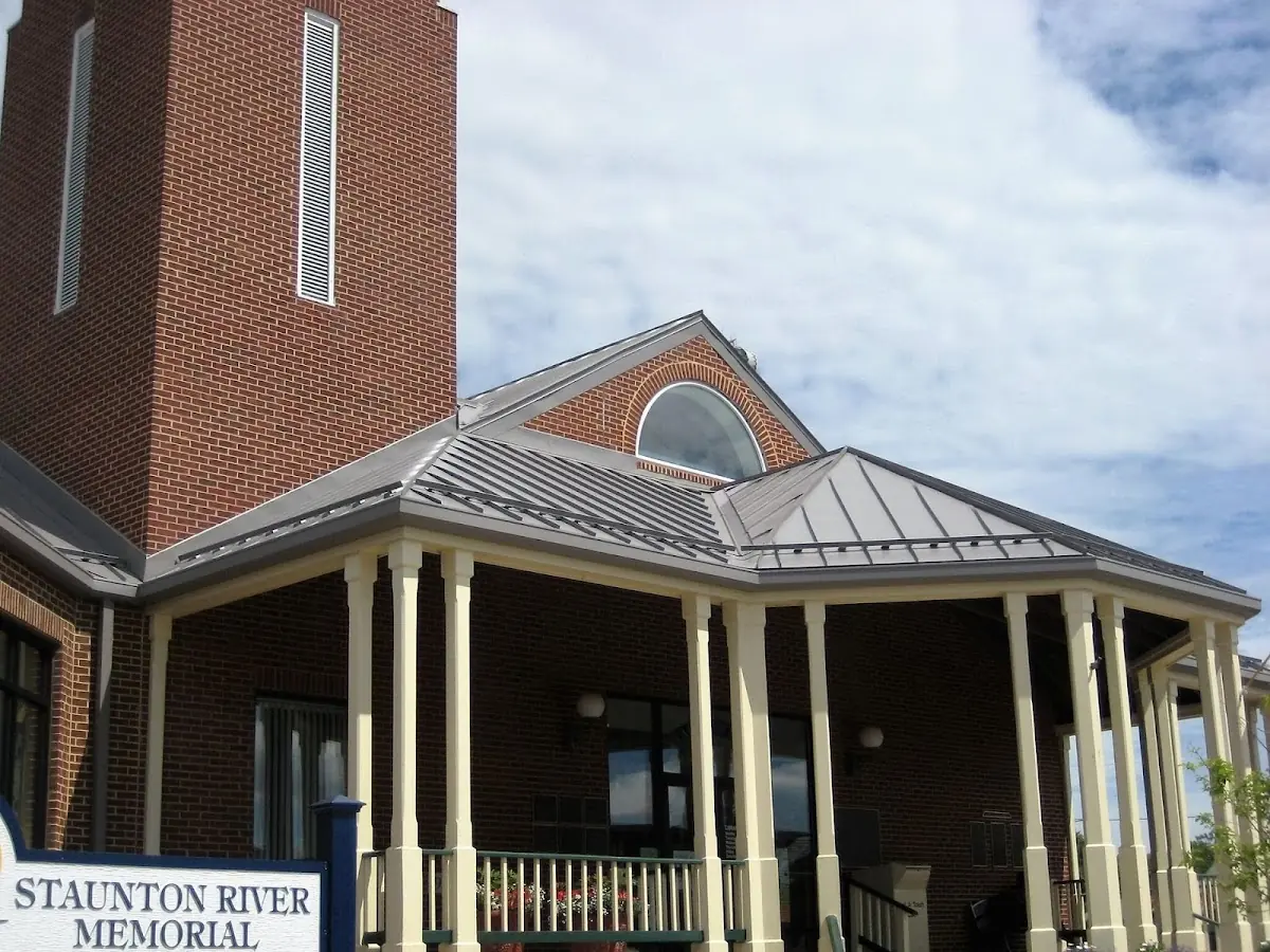 Skilled roofing craftsmen working on a residential roof in Powdersville